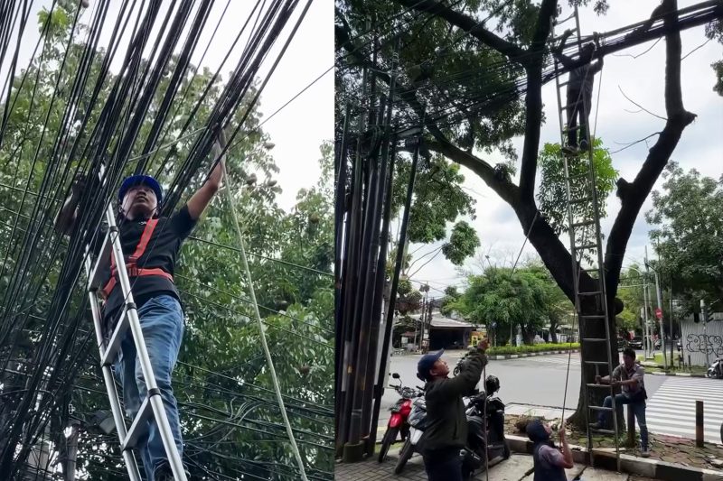 Diskominfo) Kota Bandung melakukan perapian kabel udara di Jalan Cikawao pada Selasa, (18/3/2025).